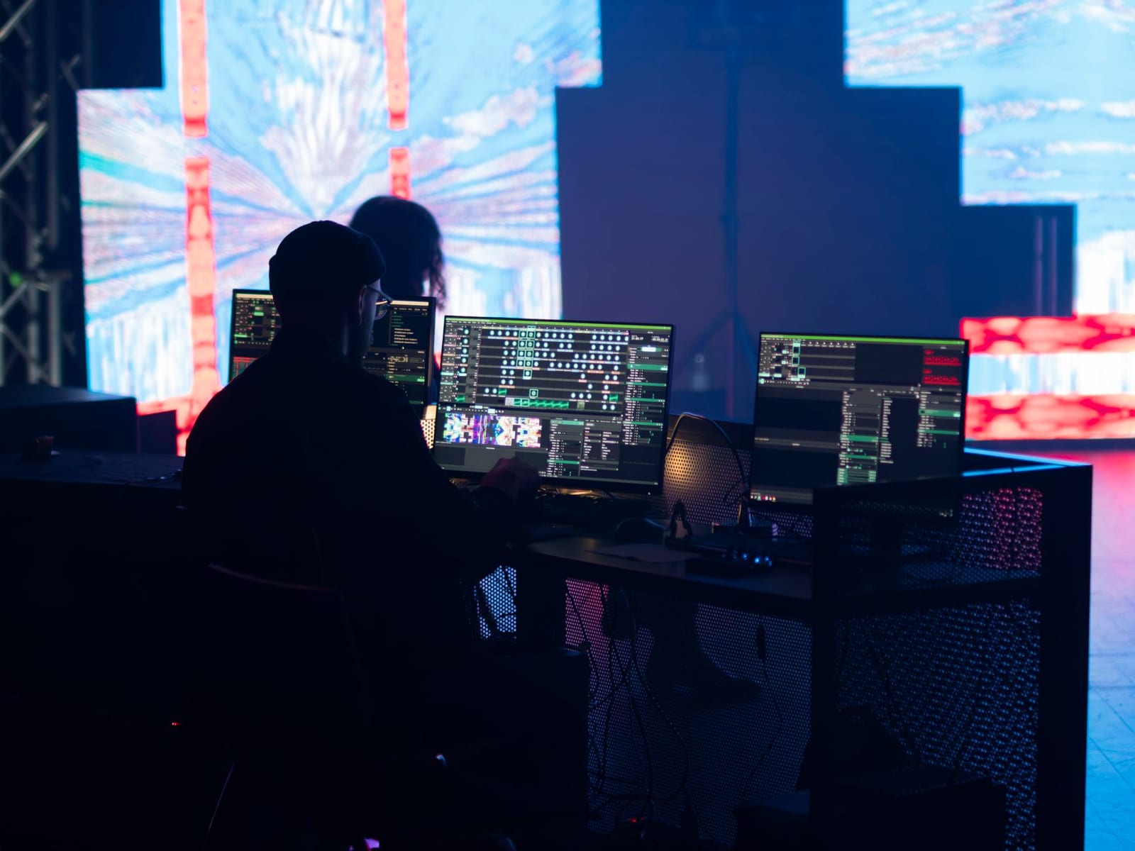 A technician monitoring screens during a live event setup