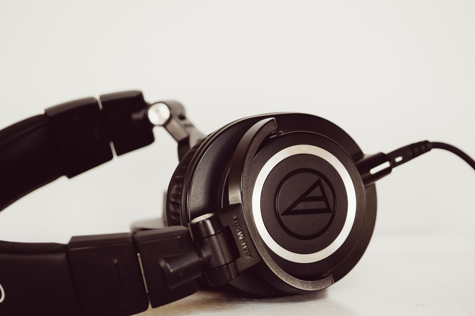 Black over-ear studio headphones on a white surface