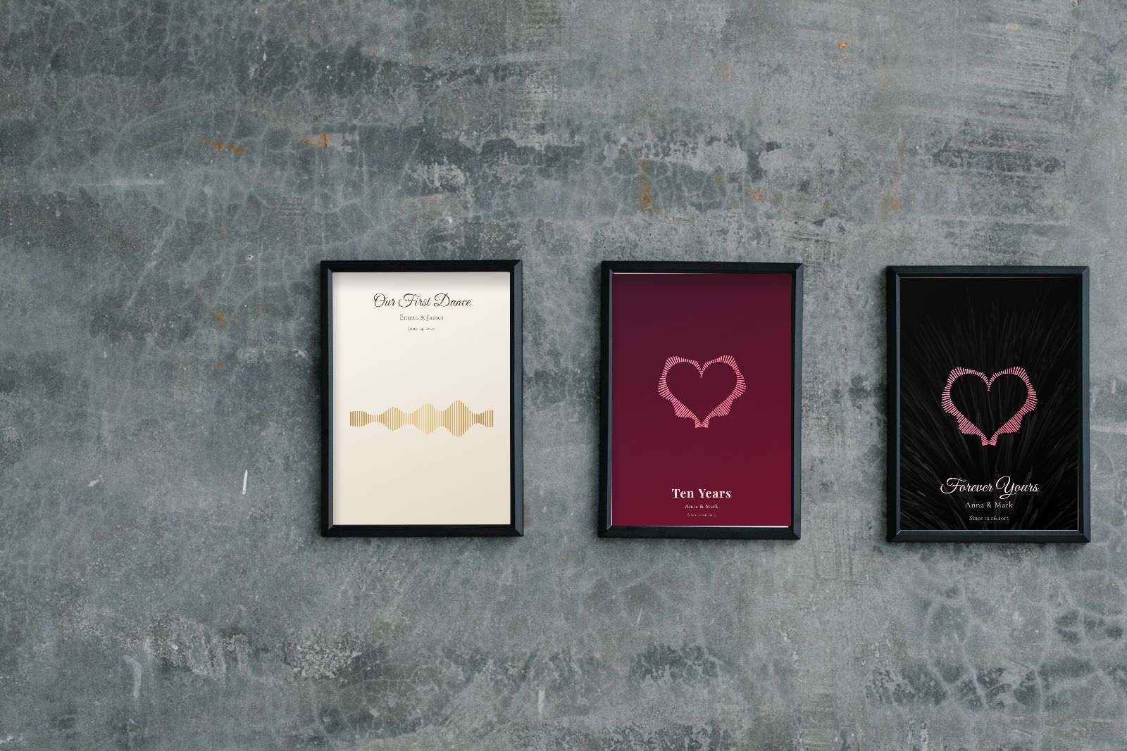 Three framed sound wave prints on a grey concrete wall: a gold wave on ivory titled Our First Dance, a pink heart on deep red titled Ten Years, and a pink heart on a dark photo titled Forever Yours